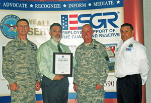 Joe Franco receives the Employer Support of the Guard and Reserve (ESGR) Seven Seals Award in June at a New Mexico ESGR recognition event in Carlsbad, N.M. From left: Assistant Adjutant General for Air and Commander of the New Mexico Air National Guard Colonel Steven J. VerHelst; Joe Franco; N.M. Army National Guard Chief of Staff Colonel Timothy Paul; and Eddy County, N.M. ESGR Chairman Tony Renteria.